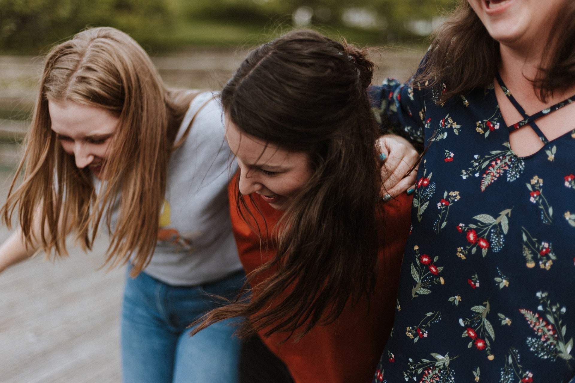 three friends laughing together