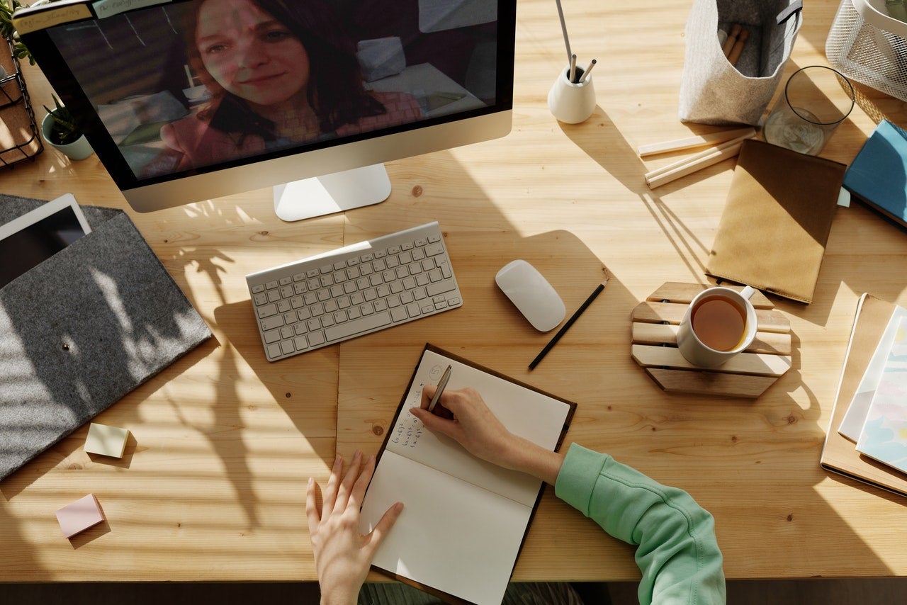person at desk video interviewing person at desk video interviewing