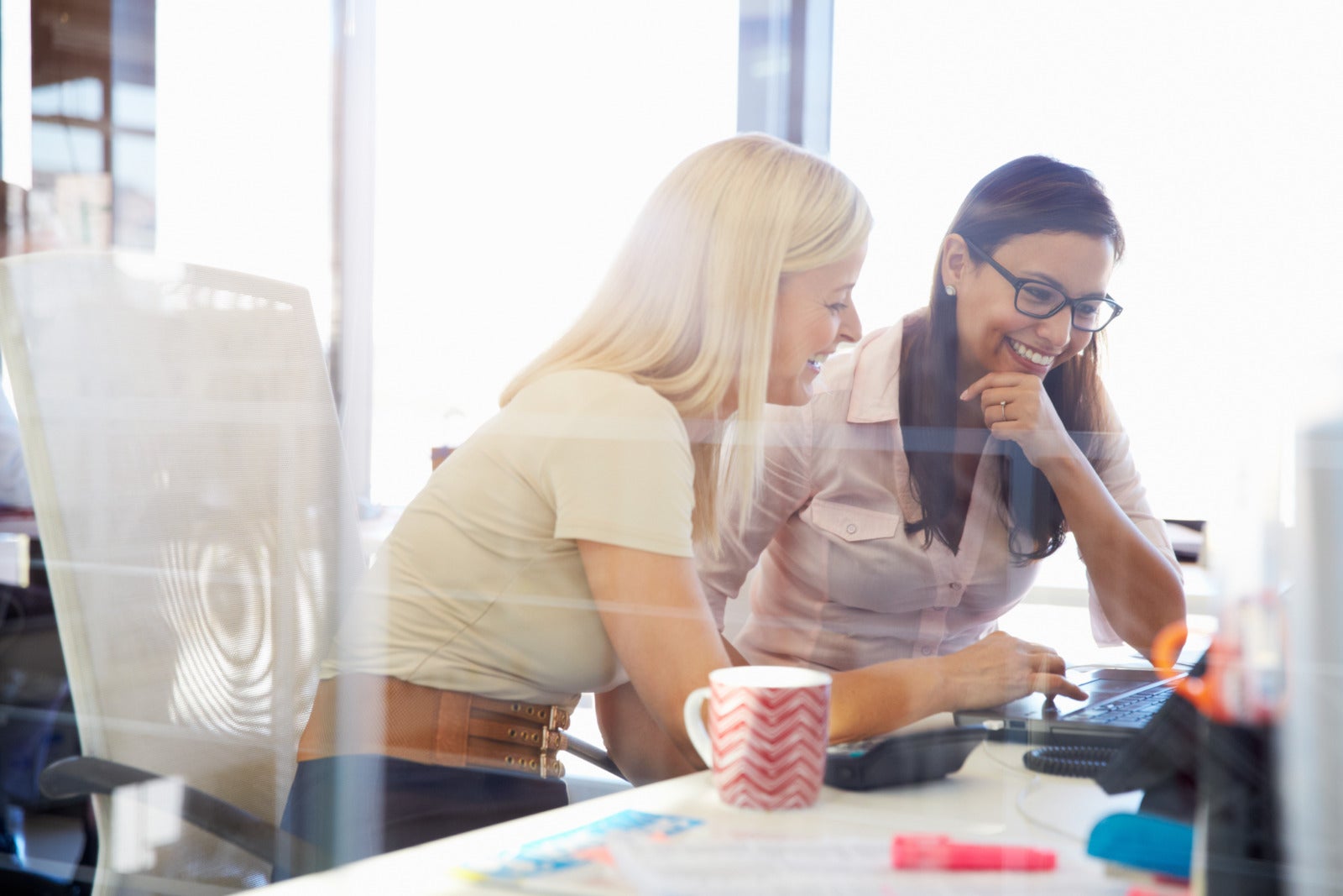 Women working together in an office setting