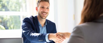 hiring manager and job candidate shake hands