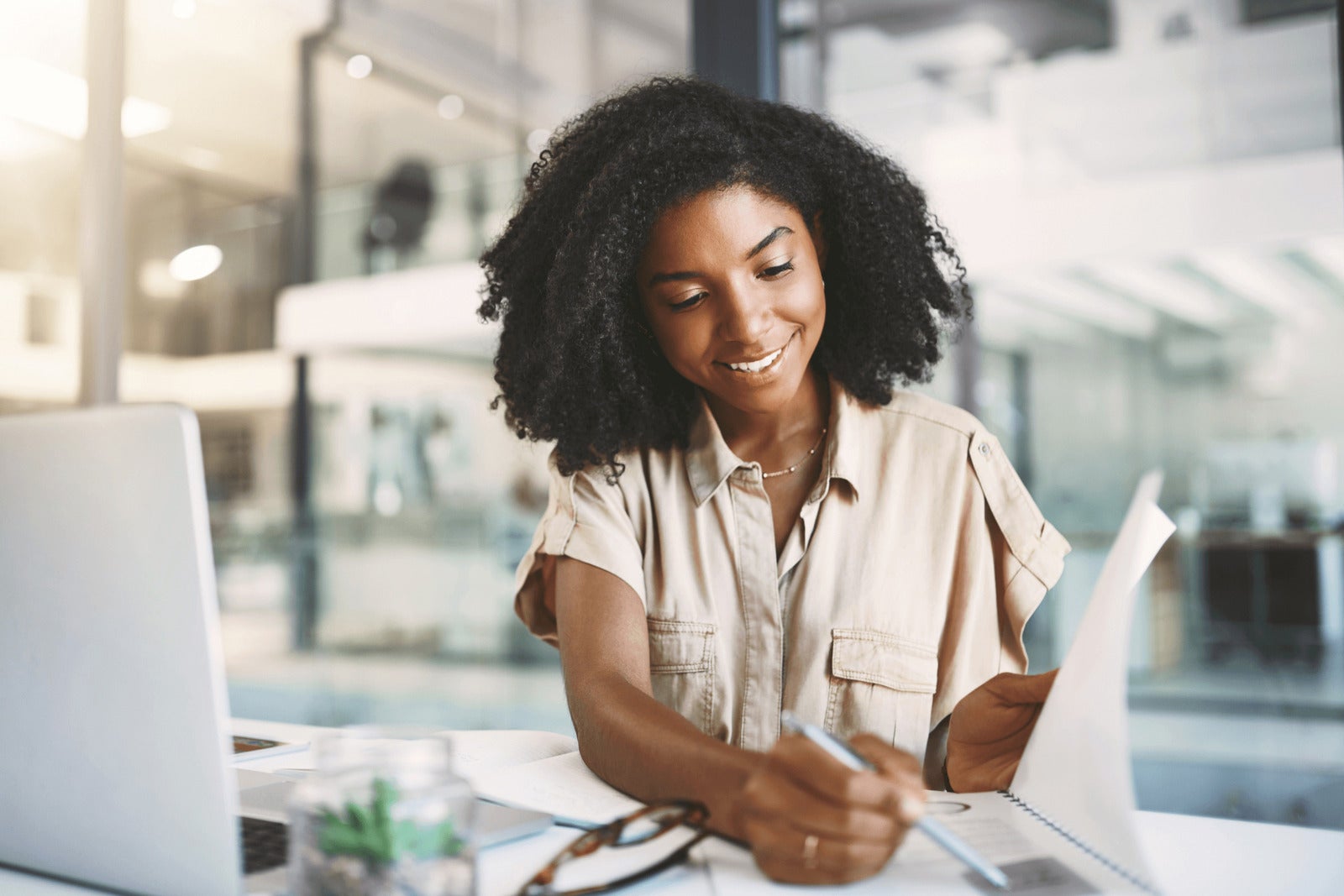 young business professional analyzes data at desk